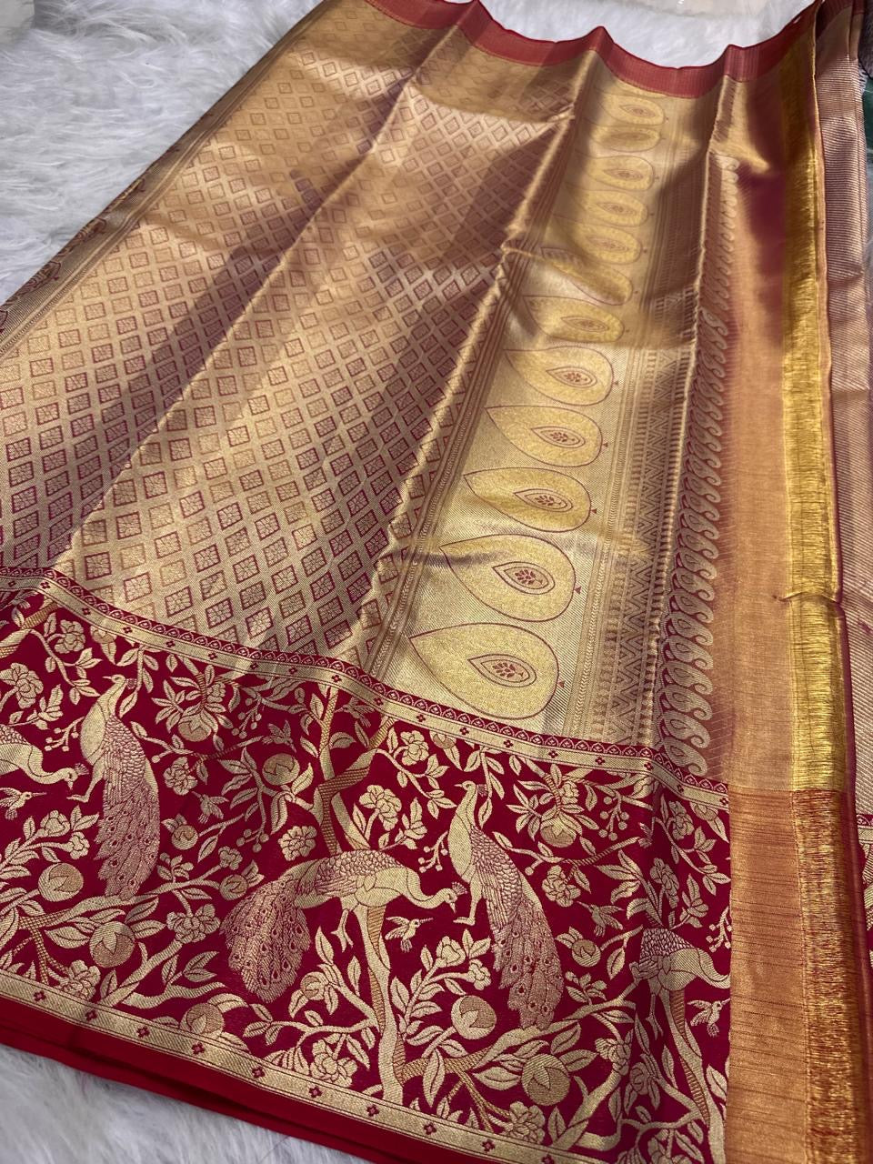 Crimson Kanchipuram border with large peacock and floral gold zari motifs