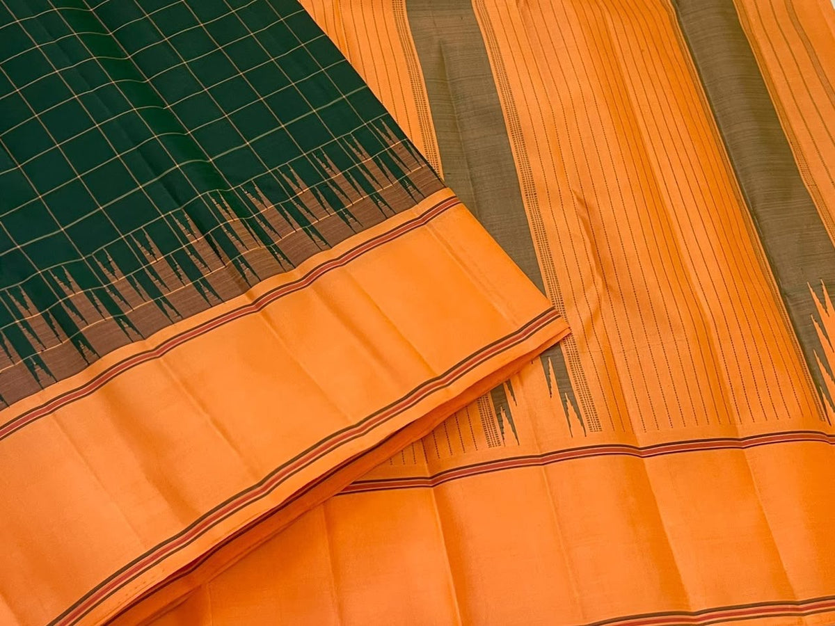 Handwoven pure silk Kanchipuram saree in forest green with Thazhampoo Reku border