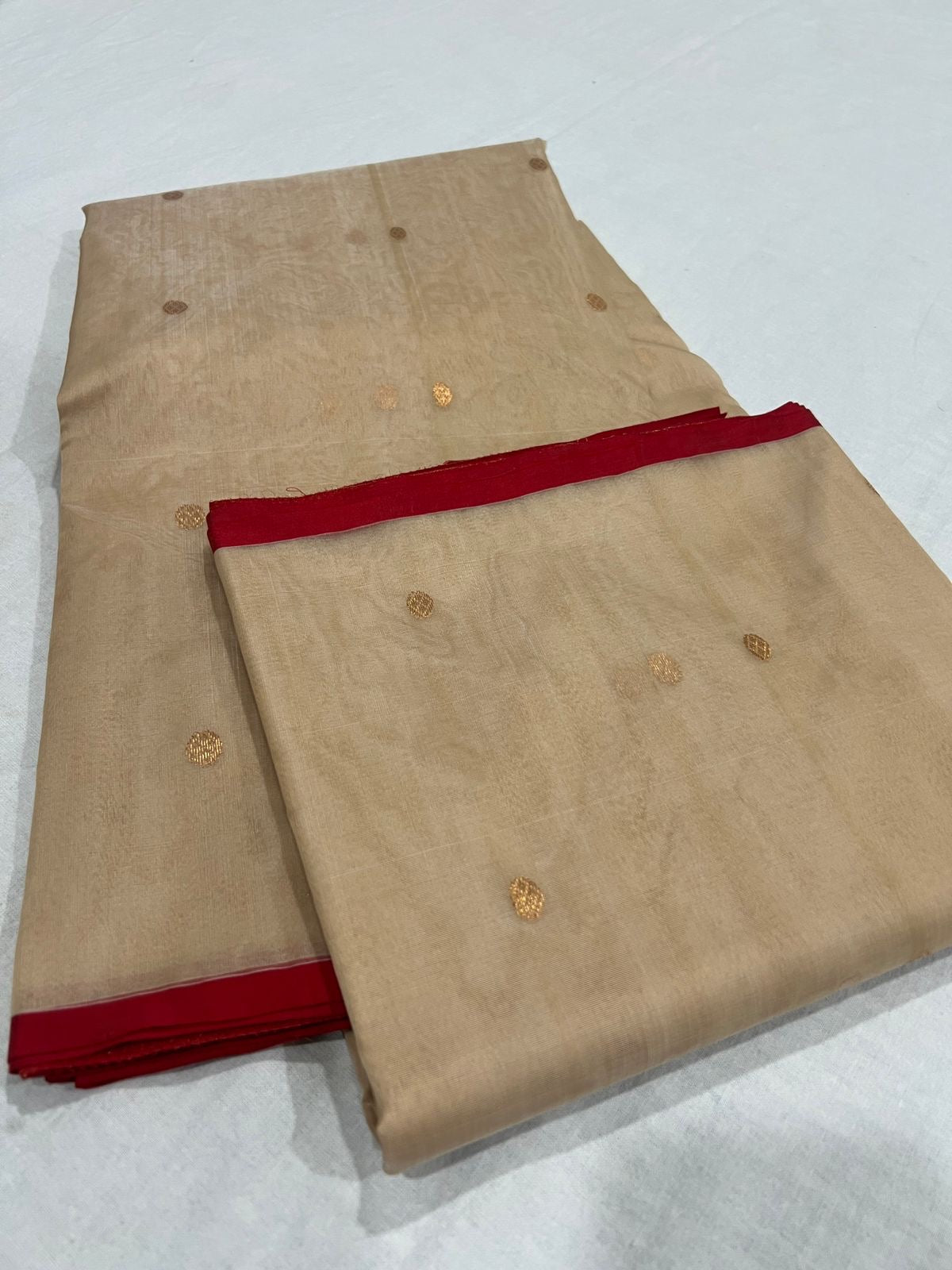 Draped Sandalwood Beige Chanderi Katan Silk saree with fine gold woven buttas and red edging