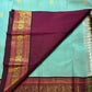Wide deep maroon Varisaipet border with layered gold zari bands and Kamalam Kili motifs on sky blue Kanchipuram silk