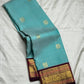 Sky blue and maroon Kanchipuram butta saree folded flat — full length view