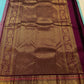 Pale sky blue Kanchipuram saree body with scattered Kamalam and Kili butta in gold zari — close-up