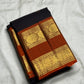 Rustic cinnamon red rettapet border with dense gold zari pallu on dark charcoal Kancheepuram saree — Idam Living