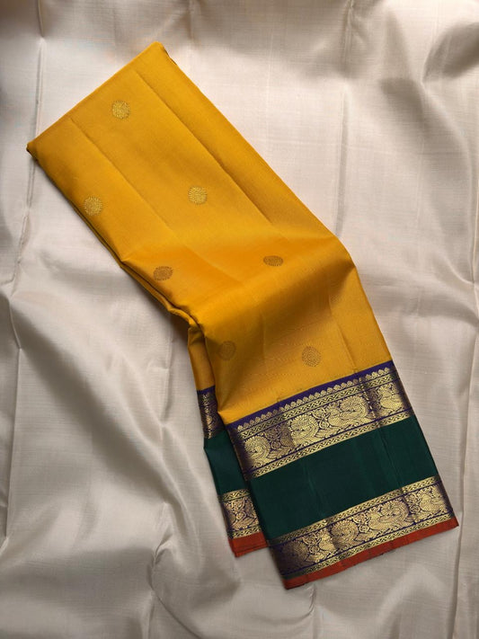 Turmeric yellow handwoven Pure Silk Kanjivaram Rettapet saree