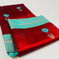 Full view of the Vermilion Red handloom Pattu Silk Chanderi saree with Aqua Blue contrast border
