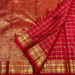 Radiant vermilion Kanjivaram silk saree with buttas at alternate intersections