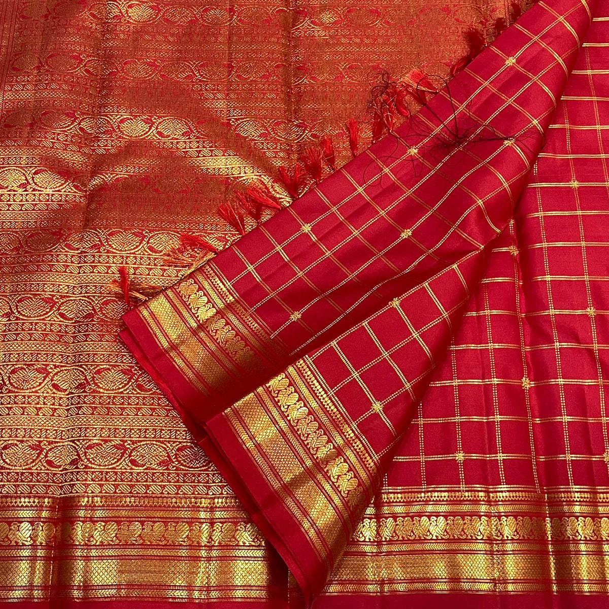 Radiant vermilion Kanjivaram silk saree with buttas at alternate intersections