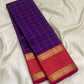 Close-up of deep violet silk body with gold zari Kanchi Kattam check grid on Kancheepuram saree