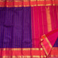 Coral red pallu with gold zari temple motifs on Rettapet Kanchi Kattam Kanjivaram saree