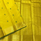 Yellow and green silk thread butta Kancheepuram saree folded flat view