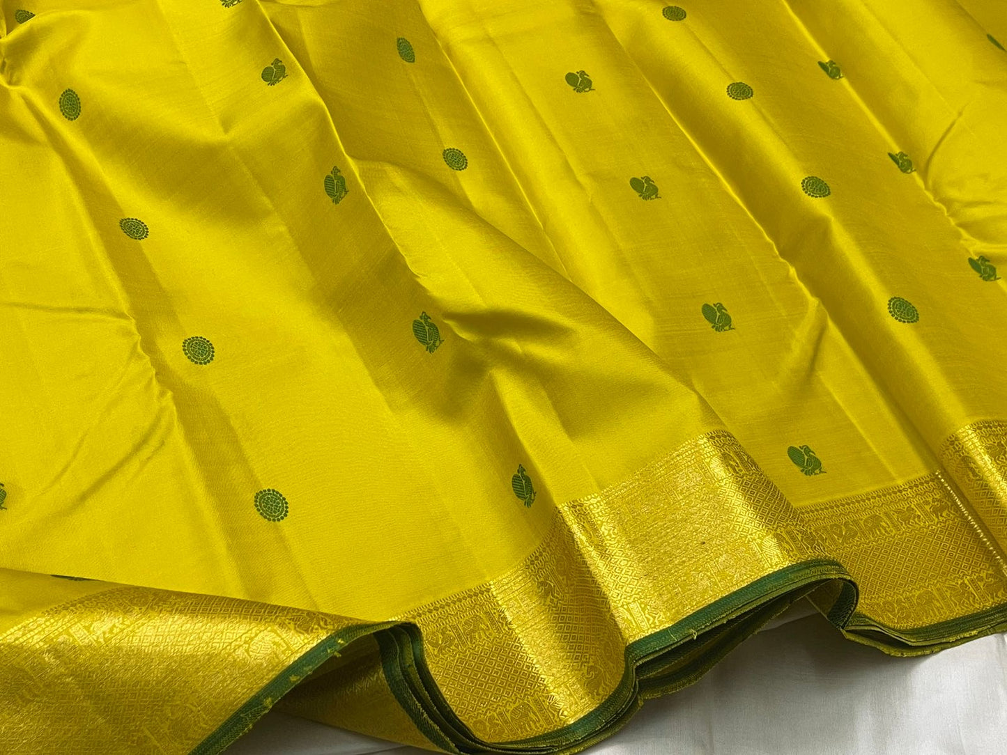 Green silk thread Kili butta and medallion butta detail on yellow silk body