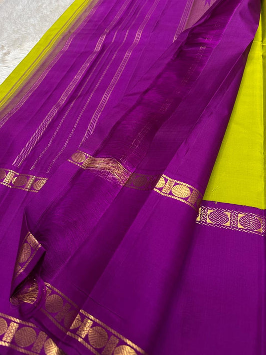 Green pallu of Kanchipuram silk saree with gold zari border and tassel finish
