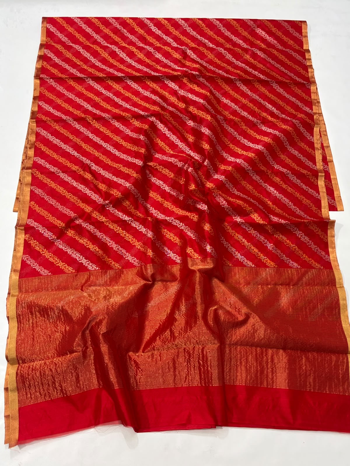 Draped Vermilion Red handloom Chanderi silk saree showing gold-toned pallu