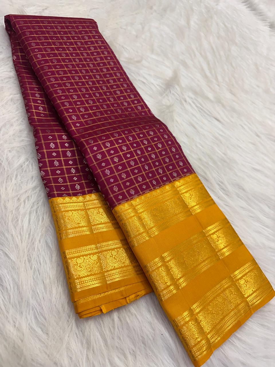 Handwoven pure silk Kanchipuram zari kattam saree in plum purple with manjal yellow contrast and tiny gold buttas.