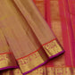 Handwoven Kanjivaram saree warm sandal gold with fuchsia pink korvai border – drape detail