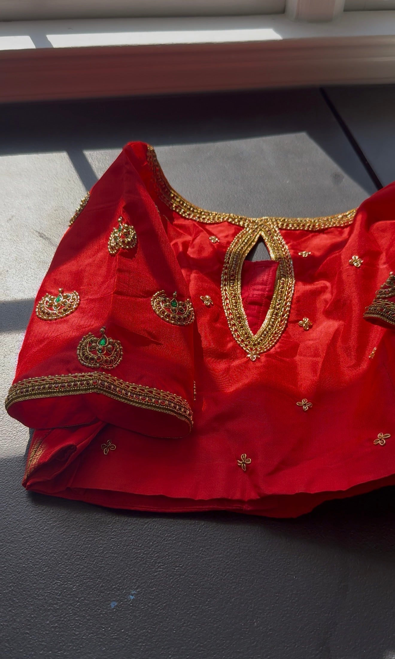 Designer silk blouse with intricate maggam embroidery and custom kemp stone embellishments