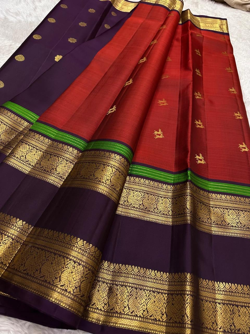 Pure silk Kanchivaram saree with majestic Yaanai elephant motifs woven in antique gold zari