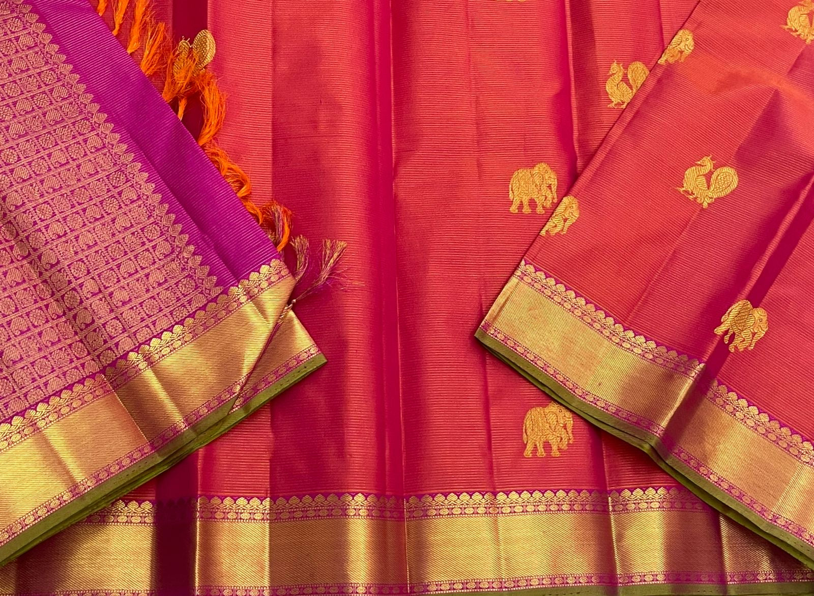 Detailed purple pallu weave pattern with gold zari border and green edge next to rani pink vairaoosi body