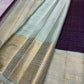 Soft Alli Pachai mint-sage Kanchipuram border with broad traditional gold zari ornamental registers.