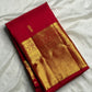 Body detail showing two alternating ornamental gold zari buttas on Pillar-Box Red silk.