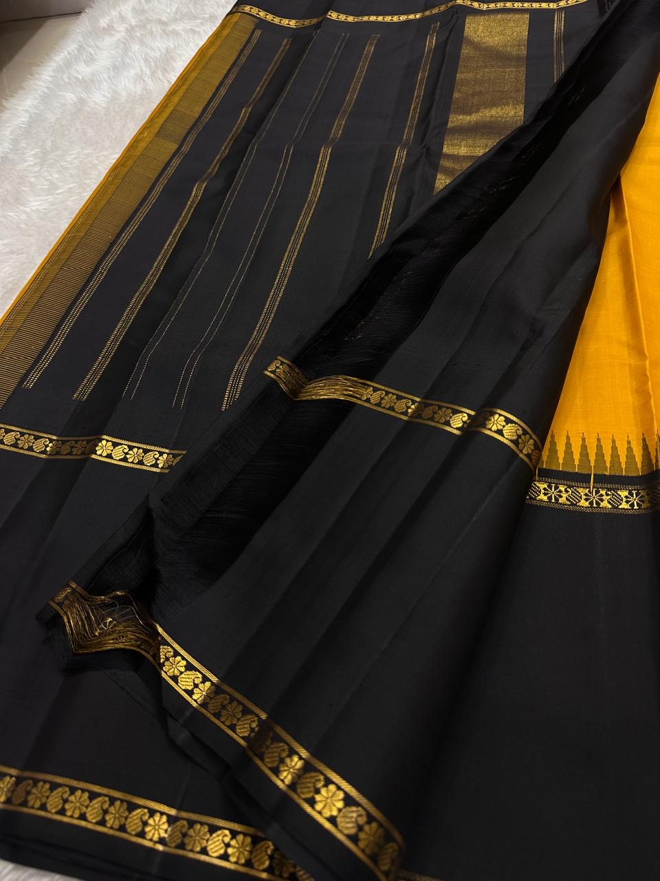 Rettapet Veldhari black gold zari border detail on amber Kancheepuram silk saree — Idam Living