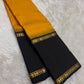 Amber yellow Kanjeevaram saree with Rettapet weave and black Korvai pallu — Idam Living