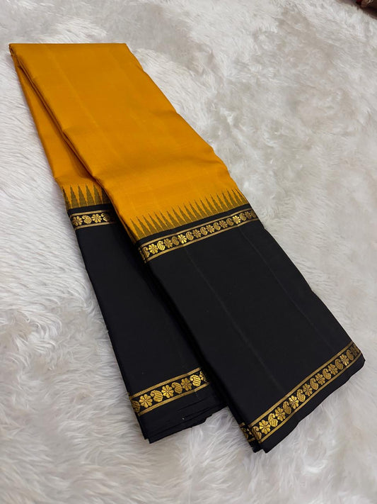 Amber yellow Kanjeevaram saree with Rettapet weave and black Korvai pallu — Idam Living