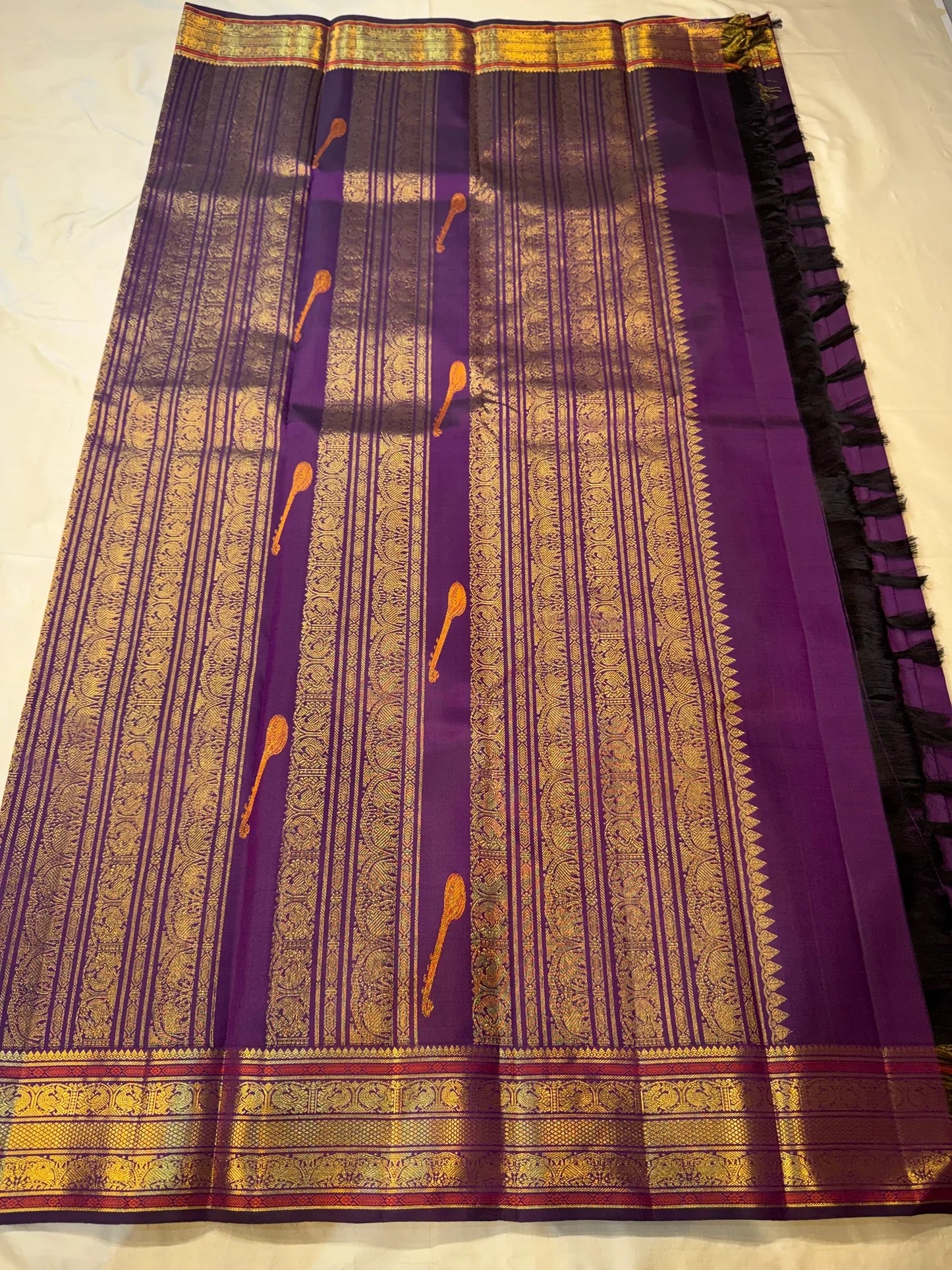 Amethyst purple Kanjivaram silk saree with orange red korvai pallu and zari border