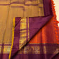 Full spread rust orange Pure Kanchipuram silk saree with round motifs and deep purple zari woven borders, shipped from New Jersey USA