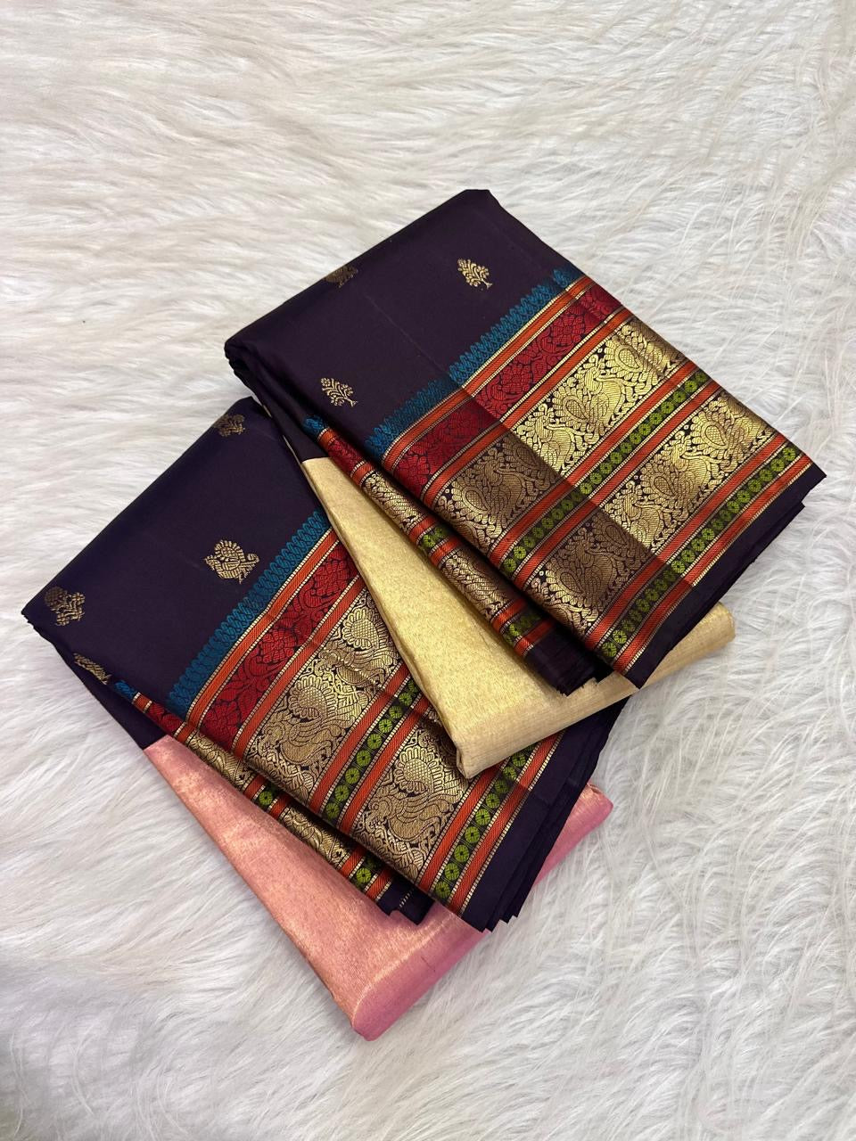 Coral red peacock blue and green woven accents in Kanchipuram border