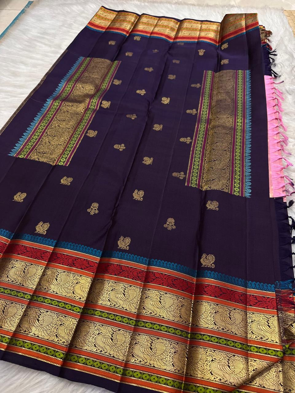 Layered gold zari and multicolour silk thread border on Kanjivaram saree