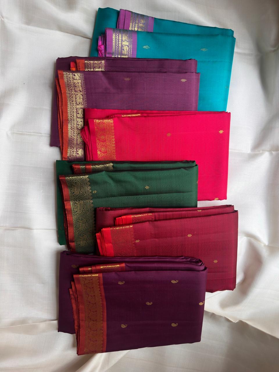 Close view of antique-gold zari butta on Aqua Turquoise pure silk Kanjivaram.
