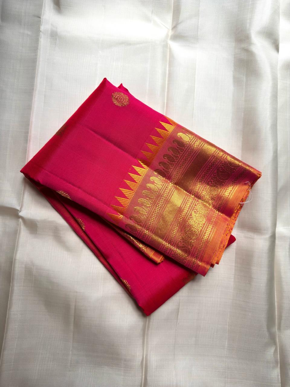Rani pink Kanjeevaram silk saree with antique gold border and magenta accents