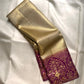 Antique Gold Kanchipuram silk saree with fine all-over chevron zari texture and richly woven purple border.