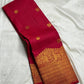 Folded Red Deep Pink Kanchipuram Butta saree showing antique-gold figurative Turning Border and fine zari registers.
