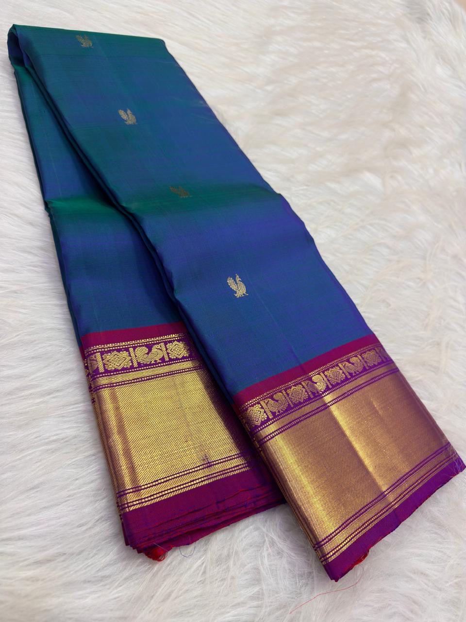 Peacock Blue Handwoven Pure Silk Kanchipuram Saree with Petite Zari Buttas and Magenta Gold Border