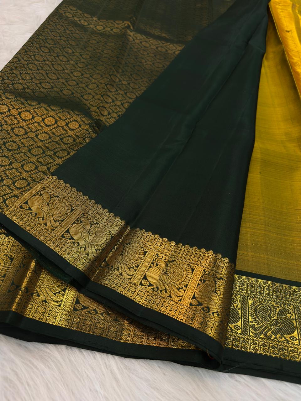 Antique Mustard Gold Kanchipuram saree with Deep Forest Green Mayil border and pallu.
