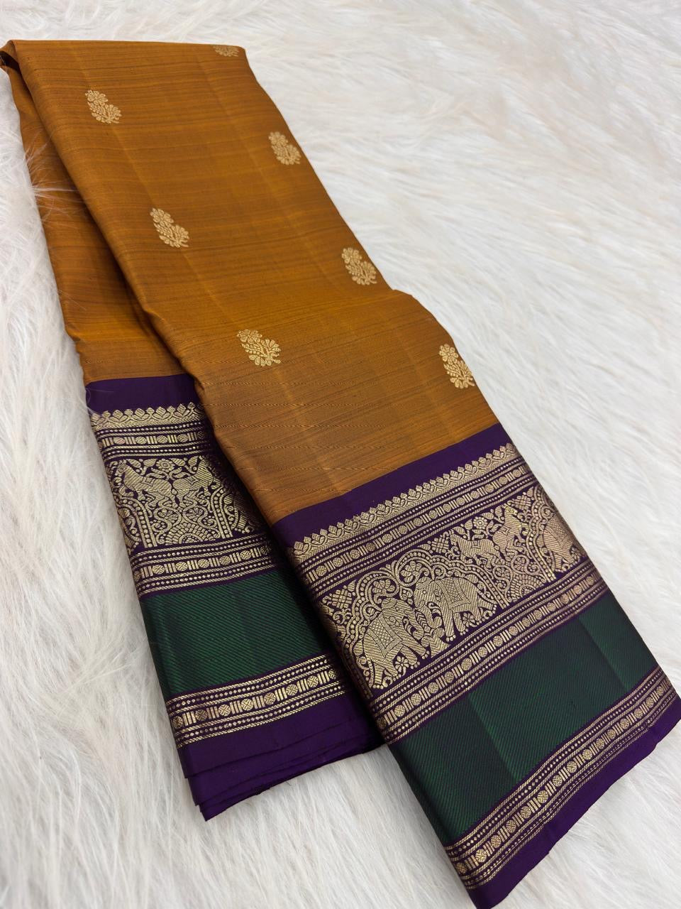 Antique Mustard Gold Kancheepuram Saree — royal-purple and emerald-green border with elephant and peacock motifs
