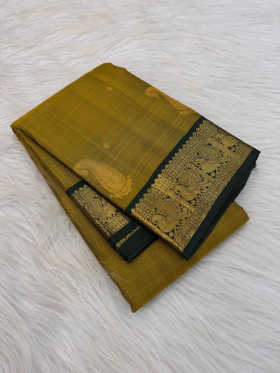 Antique Mustard Gold pure silk Kanjipuram Butta saree with Deep Forest Green border.