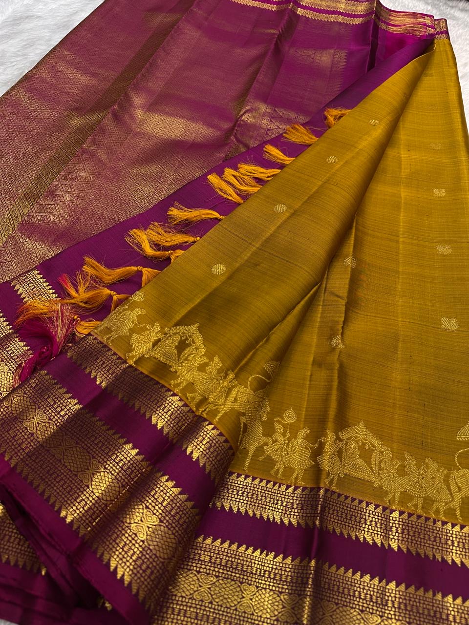 Mustard Gold Kanjivaram saree with intricately woven ceremonial procession motifs