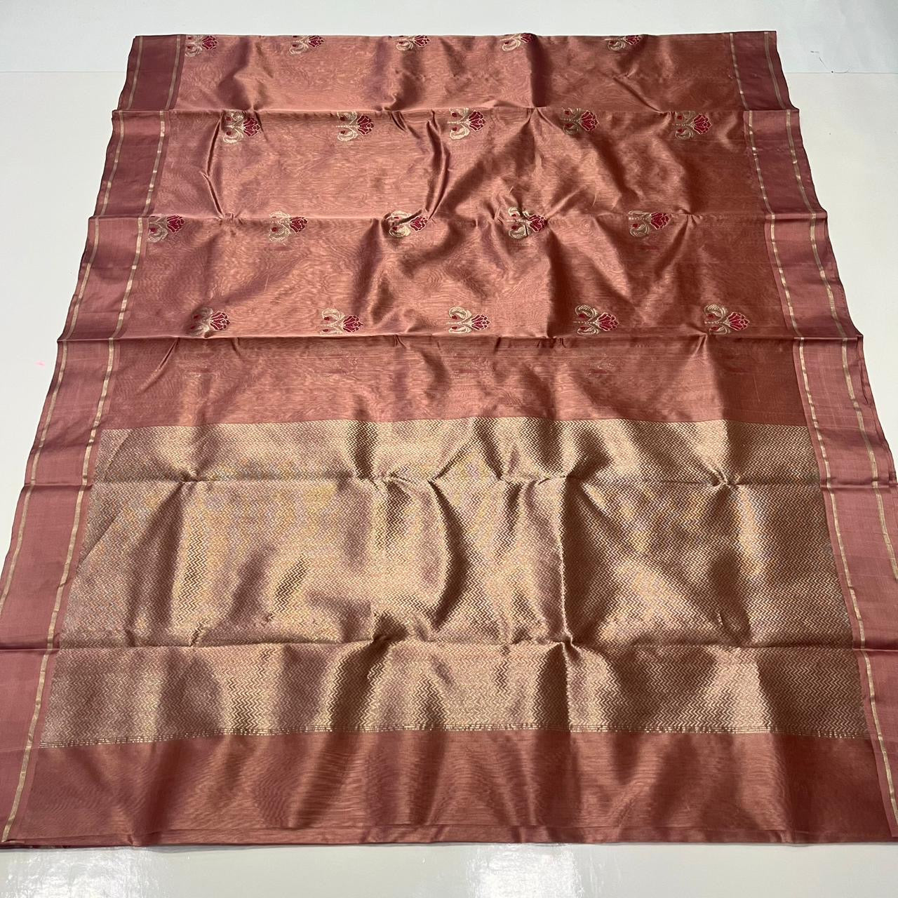 Folded Antique Rose Chanderi saree showing running blouse piece and fine zari border