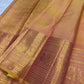 Antique Rose and gold layered zari border on Peach Gold Kanchipuram Butta saree.