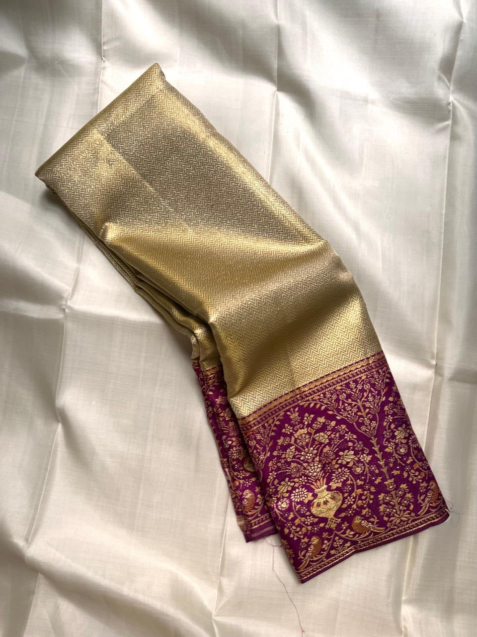 Antique Sage Gold Kanchipuram silk saree with fine all-over chevron metallic weaving and rich purple border.