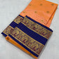 Folded Apricot Peach Chanderi silk saree with gold floral buttas and Royal Blue woven border