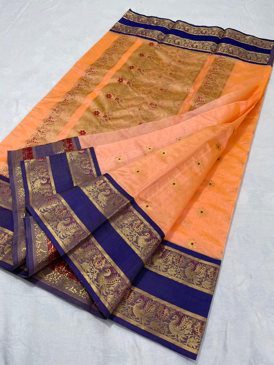Apricot Peach handloom Pattu Silk Chanderi saree with Royal Blue ornamental border and gold-toned woven pallu
