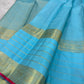 Handwoven Sky Blue Varisaipet saree with traditional antique-gold zari registers.