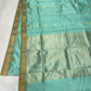Aqua Blue handloom Chanderi silk saree with gold buttas, olive green edged border and pale metallic woven pallu