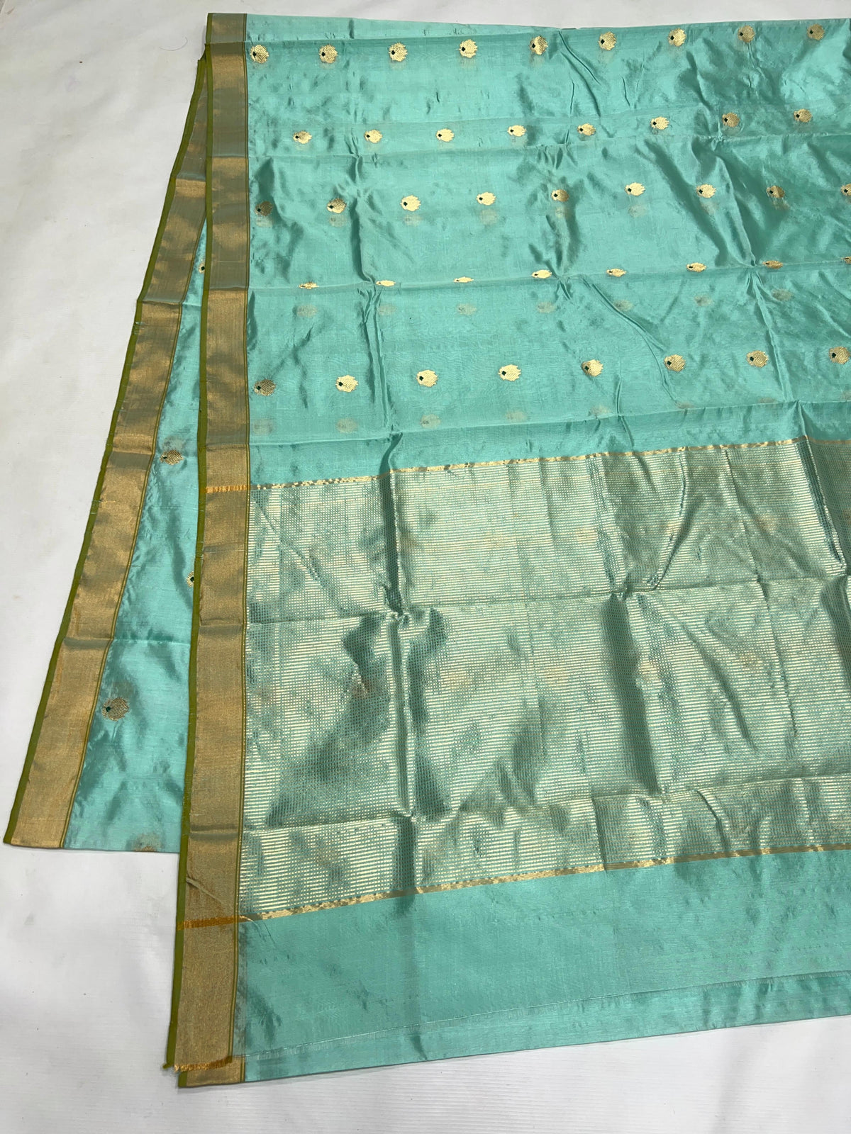 Aqua Blue handloom Chanderi silk saree with gold buttas, olive green edged border and pale metallic woven pallu
