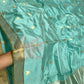 Aqua Blue handloom Chanderi silk saree displayed in full to show the overall drape and gold buttas