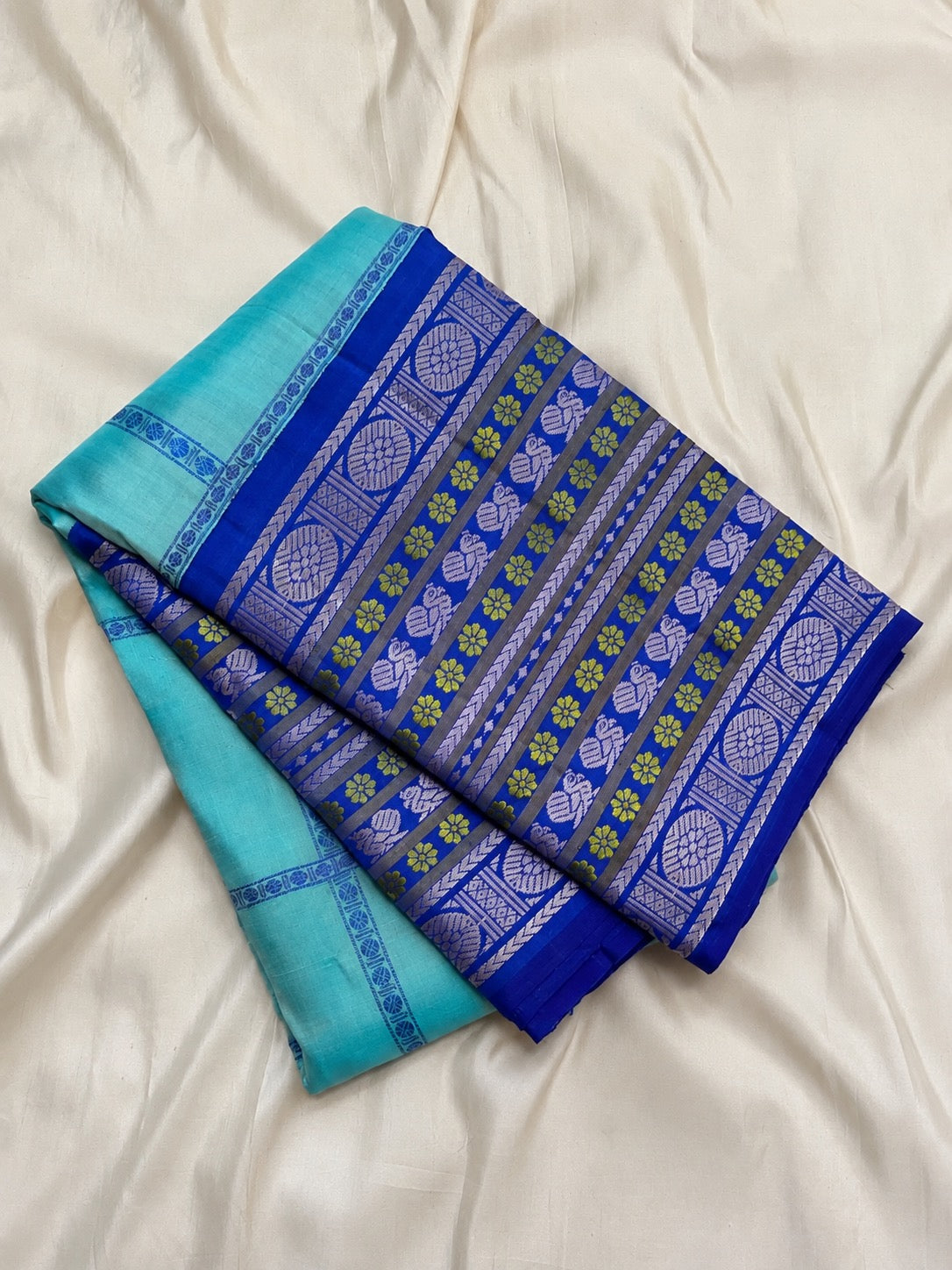 Cobalt blue pattupet border with silk-thread motif bands.